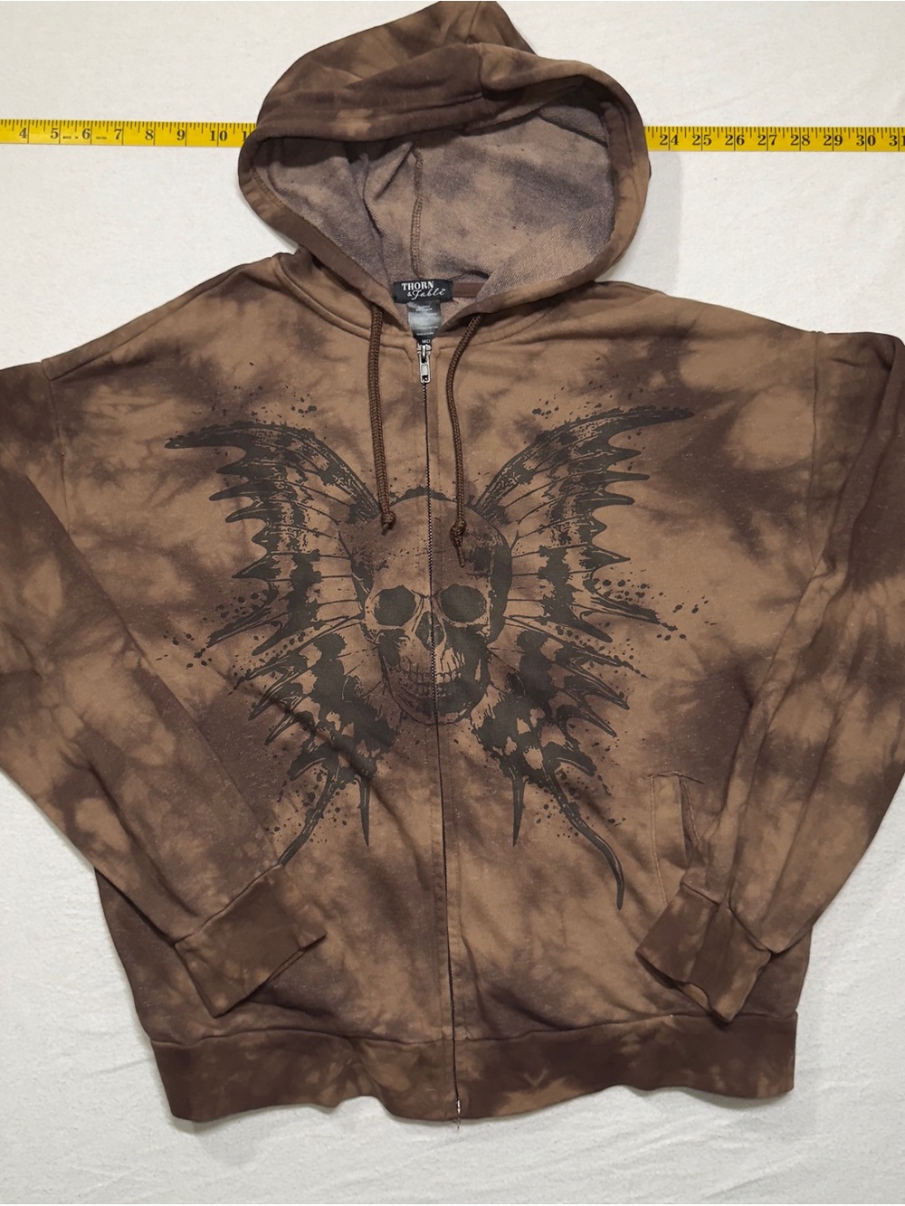 Tie-Dye Brown Zip Hoodie with Winged Skull Graphic thorn and fable